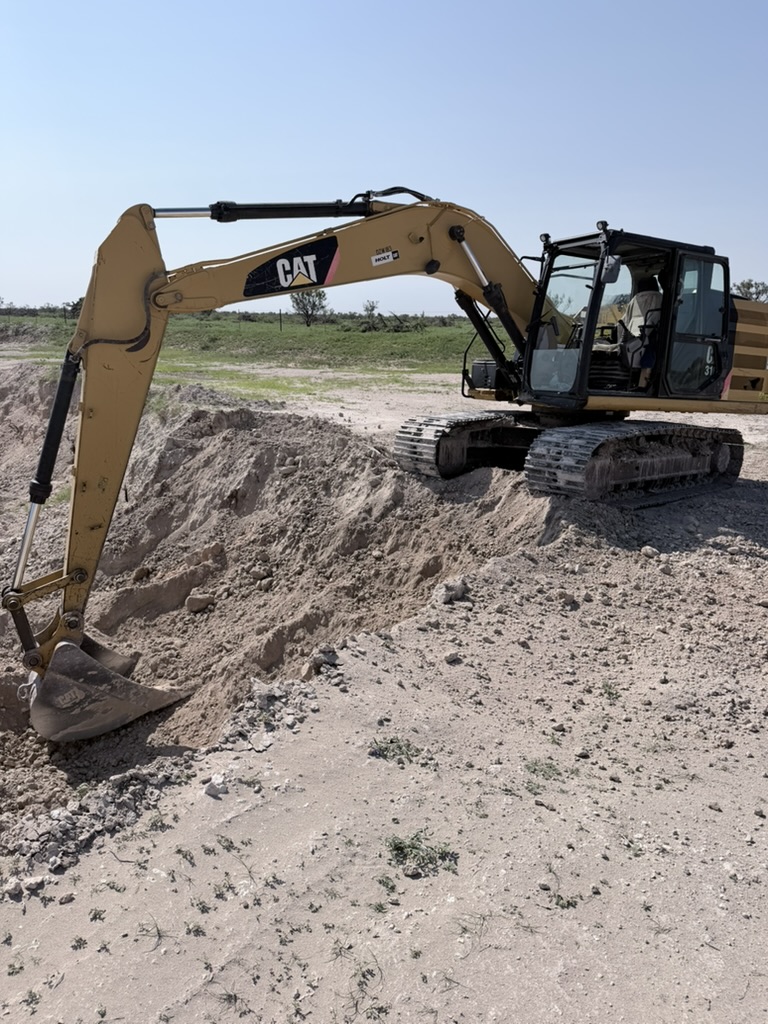Excavator at a pit